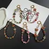 Colgante de campanilla exótico versátil de moda cadena corta funda de teléfono universal llavero accesorio para bolso