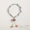 Pulsera de cristal de baya morada de piedra natural con diseño bodhi de luna y estrella, pulsera de diseño de nicho de lujo ligero de otoño e invierno, pulsera de lirio del valle, regalo para mujer