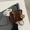 Bolsa de Mão Feminina Estilo Balde Cor Sólida Moda Nova Coleção Outono 2026 Bolsa de Ombro Vintage Casual para o Dia a Dia Bolsa Transversal Tendência
