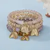 Pulsera bohemia multicapa de cristal de moda transfronteriza con colgante de hoja y cordón elástico, disponible para venta al por mayor del fabricante