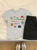 Camiseta Manga Curta Gola Redonda Algodão Puro Estampa Divertida Caimento Solto Ombro Normal Design Estilo Coreano Verão 2026 para Mulheres, Rejuvenescedora e Adequada para o Trabalho