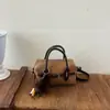Elegante bolso de bolos de bloques de color de alta calidad para mujer, un bolso de hombro que también se puede llevar cruzado, nuevo bolso tote casual y elegante otoño 2026
