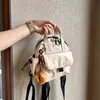 Mochila pequeña ligera y linda, versión de cuero impermeable, bolso de mano pequeño, mochila de moda impermeable versátil