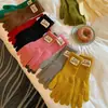 Nuevos calentadores de muñeca rojos de Navidad extendidos, guantes de punto para mujer, adecuados para ciclismo al aire libre, con dos dedos expuestos para uso en pantalla táctil, cálidos y con dedos separados