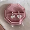 Pendientes de lazo de circonita de aguja de plata Corea del Sur ins moda dulce pendientes versátiles lujo ligero alta gama venta al por mayor