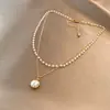 Collar con colgante de perlas de doble capa minimalista para mujer, versátil y elegante, con un aire de moda de alta gama, cadena para la clavícula de diseño único