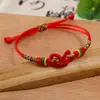 Venta al por mayor del fabricante Pulsera de Cuerda Colorida Hilo Rojo Estilo Coreano Hebilla de Flor de Ciruelo Hebilla de Piña Bola de Hilo Colorido Pulsera del Festival del Bote del Dragón de Hilo Rojo