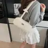 Bolso de mano de nicho estilo coreano para mujer, bolsa de bolos vintage, nuevo modelo 2026, bolso de hombro de alta gama de gran capacidad
