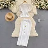 Traje de moda Comercio exterior transfronterizo Temperamento transfronterizo Top de punto de manga corta Falda de ajuste ceñido con hebilla metálica Conjunto de dos piezas