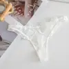 Ropa interior de encaje ultradelgada de comercio exterior para niñas, sexy y seductora, tanga negra, pantalón T de malla de deseo puro para verano