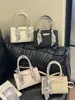 Bolsa de Mão Versátil Moda Transfronteiriça 2026 Verão Nova Bolsa Quadrada Pequena Bolsa de Ombro Bolsa Transversal de Nicho de Alto Padrão