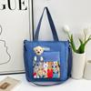 2026 Nueva Bolsa de Hombro de Dibujos Animados Linda Bolso Cruzado para Temporada Escolar Gran Capacidad Bolsa de Maquillaje Bolso de Moda Transfronterizo