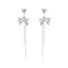 Pendientes largos de borlas de moda y sencillos con lazo para mujer, dulces y juveniles, versátiles y que afinan el rostro, pendientes de botón