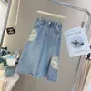 Conjunto de Ropa de Verano para Niñas 2026 Nuevo Estilo para Niños Medianos y Mayores Nuevo Estilo Chino Camiseta de Manga Corta Falda de Mezclilla a la Moda Conjunto de Dos Piezas