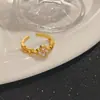 Novo anel de trevo de quatro folhas com zircônia cúbica estilo coreano, um design de anel aberto moderno e versátil para mulheres, um item de joalheria transfronteiriço moderno e popular