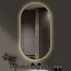 Espelho inteligente de banheiro oval com moldura de alumínio, espelho com iluminação LED, espelho de parede para toucador para o banheiro, disponível para vendas transfronteiriças e personalizável