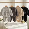 Conjunto Esportivo de Duas Peças para Meninos Primavera e Outono Estilo Coreano Lindo Dinossauro Moletom de Gola Redonda Calça de Moletom Conjunto de Duas Peças para Crianças ao Ar Livre