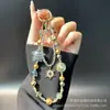 Cadena Creativa para Teléfono Móvil con Estrellas de Pintura al Óleo, Colgante para Bolso con Copos de Nieve y Pedrería, Cadena de Aleación con Cadena de Cristal y Perlas para Mujer