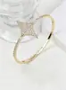 Pulseira e Anel de Estrela de Quatro Pontas Europeus e Americanos Transfronteiriços Mais Vendidos Luz de Anel Luxo de Alto Padrão Brilhante Zircônia Full Diamond Conjunto de Pulseira e Anel