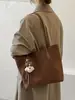 Bolso tejído de PU de moda para mujer, nuevo modelo 2026, bolso tote de gran capacidad para mujer, bolso simple para el hombro o debajo del brazo para el trabajo, transfronterizo