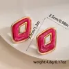Pendientes geométricos de rombos en color rojo vibrante estilo Hong Kong transfronterizos con ribete dorado, tachuelas huecas de resina de doble capa, accesorios de vestir para mujer