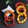 Pulsera de Cera de Abeja Ámbar de Segunda Generación Venta al por Mayor de Fábrica Ámbar Sangre Ámbar Flor Ámbar Medicina Pulsera de Cera Vieja Fluorescente Flotante Agua Salada