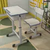 Mesas e cadeiras de plástico ABS para alunos do ensino fundamental e médio, adequadas para aulas de reforço e escolas de treinamento, com altura ajustável