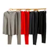 Nuevo conjunto térmico de camelia para otoño e invierno, alta elasticidad y comodidad, conjunto de capa base para calor y protección contra el frío, venta al por mayor de tops y pantalones de otoño