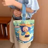 Venta al por mayor del fabricante Bolso de mano artístico de moda Bolso de lona Bolso tipo cubo de gran capacidad para mujer 2026 Nuevo Bolso para almuerzo de trabajo