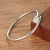 Pulsera de cuerda de alambre de acero inoxidable pulsera europea y americana de clavo espiral ajustable abierta pulsera de clavo de acero de titanio pulsera
