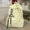 Mochila de lunares de alta calidad para niñas, adecuada para estudiantes de secundaria, con un lazo, gran capacidad y un diseño moderno y minimalista para uso escolar