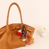 Pingente de Bolsa de Morango Tricotado à Mão Transfronteiriço Produto Acabado em Lã Pingente de Chaveiro de Girassol Tecido Pequeno Presente