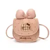 Nueva bolsa para niños, con un lindo diseño de caricatura con un moño, un monedero mini y bordado de gato. Adecuado tanto para niños como para niñas, se puede llevar como bolso cruzado o usar como estuche para auriculares.