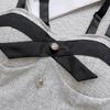Nuevo estilo Chanel chica hot sexy tirantes botón diseño nicho chaleco uso individual con top de tubo con almohadilla en el pecho