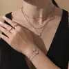 Rueda de la Fortuna Sol Antiguo Colgante de Diamantes Completos Pulsera Anillo Estilo Europeo y Americano Moda Personalizada Juego de Joyería para Mujer