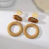 Pendientes de madera redondos transfronterizos de estilo europeo y americano para mujer, diseño geométrico retro de alta gama, pendientes de botón exagerados Maillard