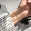 Pulsera de cadena de serpiente redonda simple japonesa y coreana acero inoxidable chapado en oro cuerda para la mano joyería de moda para hombres y mujeres pulsera fina venta al por mayor