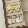 Pendientes de flores de perla Europa y Estados Unidos viento frío personalidad pendientes de alto sentido moda temperamento todo fósforo pendientes 2024 nuevo
