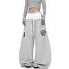 Calça de moletom retro americana de cintura dupla com bordado de letras e barra curva para homens e mulheres, novo estilo de verão, calça larga solta para dança jazz