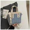 Bolso de mano casual Shuai Mi Jia, bolso tipo cubo simple para mujer, nuevo de verano 2026, estilo coreano, moderno, de nicho, bolso cruzado