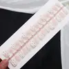 Éxito de ventas de verano: Manicura francesa en tono nude con baño de oro, diseño de concha 3D, uñas postizas con acabado de estilo de lujo ligero.