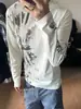 Camiseta unisex de manga larga con cuello redondo y estampado moteado estilo punk americano, hombros normales, corte ajustado como capa base, atuendo de pareja, top versátil