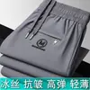 Pantalones rectos de verano de alta elasticidad transfronterizos para hombres jóvenes y de mediana edad, nuevos pantalones largos casuales de seda helada para hombre con sensación fresca, talla grande