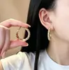 Pendientes de aro plateados versátiles y elegantes para mujer, con un diseño de lujo ligero y de alta gama, estilos nuevos y populares, pendientes de aro lisos al por mayor