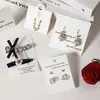 En stock venta al por mayor tarjeta de papel para aretes en relieve tarjeta plegable para collares tarjeta para exhibir anillos pinzas para el pelo tarjeta de papel tarjeta para exhibir aretes
