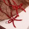 Moda europea y americana temperamento de nicho colgante explosivo cuentas de acero inoxidable hecho a mano cristal tallado rojo collar de lazo
