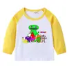 Camiseta infantil de primavera y otoño 2023, nueva camiseta de manga larga con cuello redondo y dibujos animados, camiseta de algodón para bebés y niños.