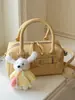 Bolsa de mano bandolera de alta gama, elegante, sencilla, estilo nuevo, primavera 2026, transfronteriza, bolso de moda y elegante para mujer