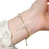 ¡Las mariposas bailan! Pulsera de flor de circón chapada en oro real, pulsera de atmósfera primaveral, joyería de diseño nicho para mujer