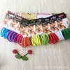 Fornecimento de fábrica super popular venda quente elástico plano moda arco-íris Natal três cores corda de cabelo anel de cabelo